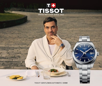 Tissot banner with actor Daniel Ings wearing Tissot Gentleman 38mm with blue dial. Tissot. Swiss Watches since 1853. Tissot gentleman automatic 38mm. Tap to shop image