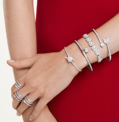 Swarovski jewellery campaign. Image of female model wearing bangles and rings from collection. image