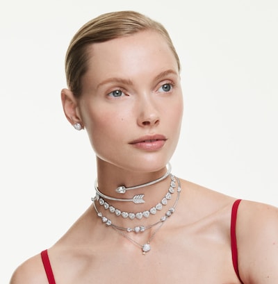 Swarovski jewellery campaign. Image of female model wearing necklaces and earrings from collection. image