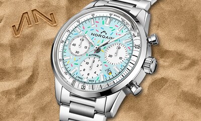Norqain watch with baby blue dial and confetti accents. Tap to shop Freedom collection image