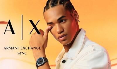 Hero Banner of a stylish watch worn on the model's wrist from Armani Exchange, accompanied by the brand logo, set against a bright orange background. image