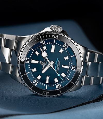 Blue Breitling Superocean 42 on satin background. WOSG Exclusive. Tap to shop Superocean collection image