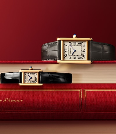 Cartier Valentines campaign with Mens & Ladies Tank watches on red covered books image