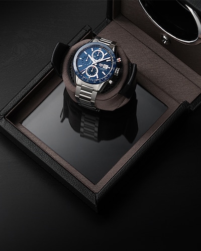 Pre-owned TAG Heuer Carrera watch displayed in a watch winder image