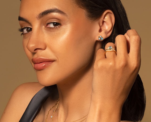 Goldsmiths model wearing Coloured Gemstone Jewellery image