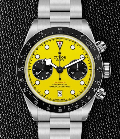 Image of tudor watch with yellow dial on black leather background. Tap to shop all tudor image