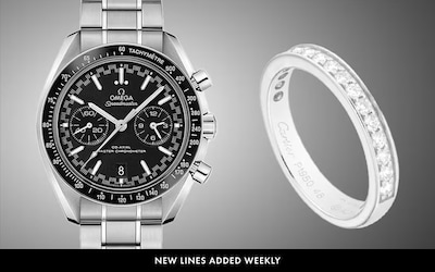 Image of Omega Speedmaster watch and Cartier White gold diamond ring. image