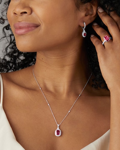 Image of female model wearing a Pink Tourmaline necklace, earrings and ring image