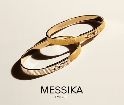 Two Messika bangles with Messika logo image