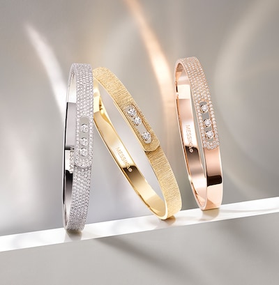 Messika Move campaign imagery and bangles on brand background. Tap to shop Messika Paris Move collection image