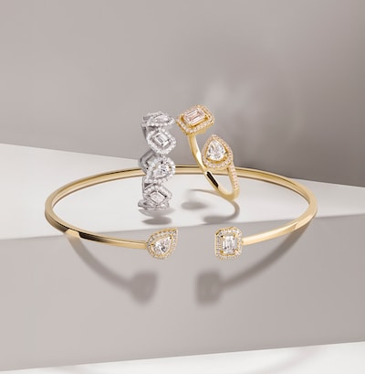Messika My Twin campaign imagery and bangle and rings on brand background. Tap to shop Messika Paris My Twin collection image