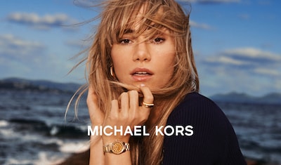 Michael Kors banner with lady wearing Michael Kors jewellery and logo image
