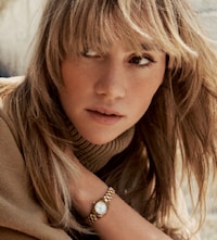 Lady wearing Michael Kors watch image