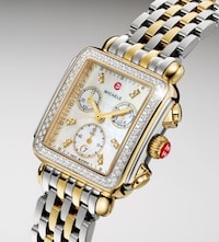 Two-tone Michele wristwatch with diamond bezel, mother-of-pearl dial, chronograph subdials, and gold-accented stainless steel bracelet. image
