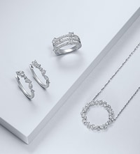 Image of diamond jewellery on white stepped background image