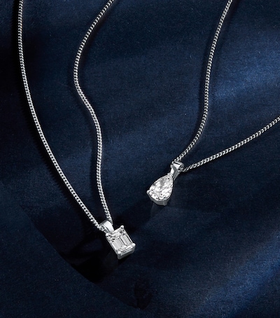 Mappin & Webb traceable diamond necklaces on blue velvet background image