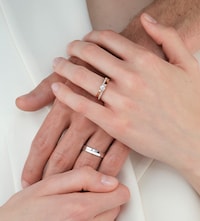 Repossi campaign imagery showing couple holding hands with rings image