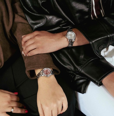 An Image of two arms wearing two different Sekonda watches image
