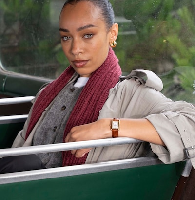 An image of a woman wearing Sekonda watch with brown strap. image