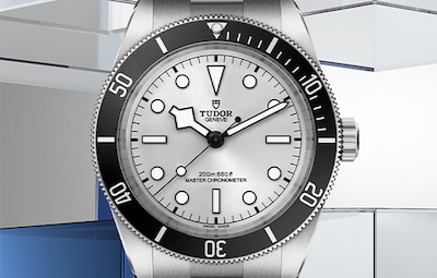 Tudor Black Bay 68 Watch on Grey and blue Background. Tap to shop TUDOR watches image