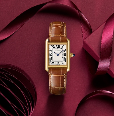 Image of Cartier Tank Louis Cartier Watch Small Model, Quartz Movement, Yellow Gold with festive background image